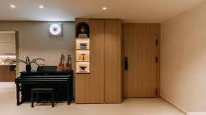 Compassvale Condominium — One Walnut Wall Doing the Work of a Room renovation Singapore